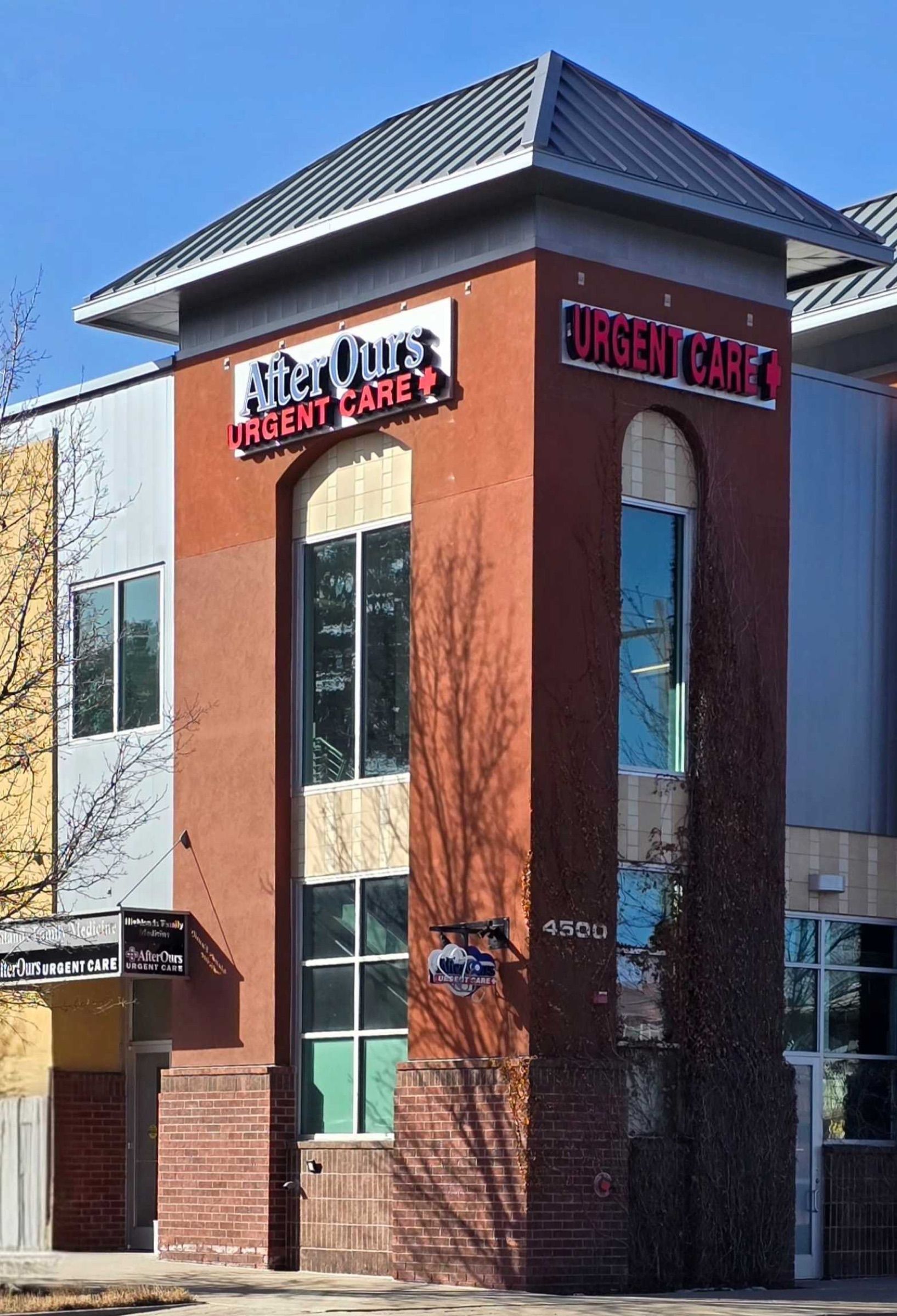 Corner tower of the Highlands clinic with the AfterOurs Urgent Care sign