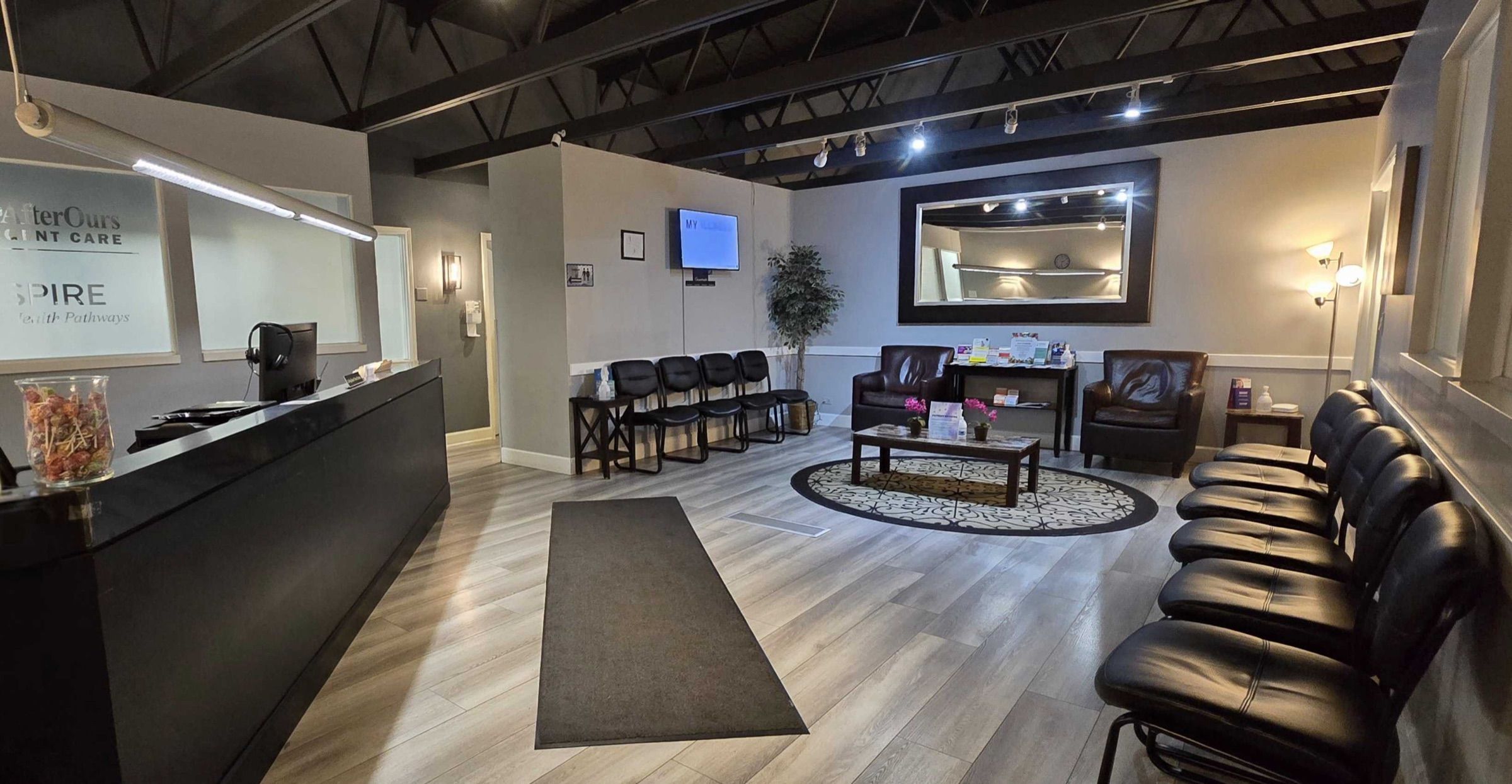 Waiting room and front desk under exposed ceiling beams