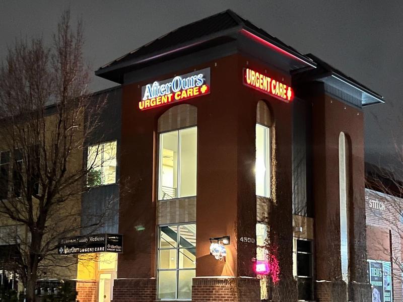 AfterOurs Denver Highlands entrance lit up at night