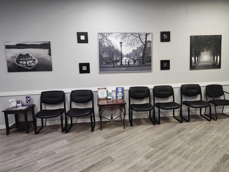 Waiting area with seating and framed art