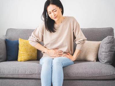 Woman sitting on couch holding her abdomen - illustrating digestive discomfort and stomach pain treated through functional medicine gut health care in Denver, Colorado Springs, and Fort Collins​​​​‌﻿‍﻿​‍​‍‌‍﻿﻿‌﻿​‍‌‍‍‌‌‍‌﻿‌‍‍‌‌‍﻿‍​‍​‍​﻿‍‍​‍​‍‌﻿​﻿‌‍​‌‌‍﻿‍‌‍‍‌‌﻿‌​‌﻿‍‌​‍﻿‍‌‍‍‌‌‍﻿﻿​‍​‍​‍﻿​​‍​‍‌‍‍​‌﻿​‍‌‍‌‌‌‍‌‍​‍​‍​﻿‍‍​‍​‍​‍﻿﻿‌﻿​﻿‌﻿‌​‌﻿‌‌‌‍‌​‌‍‍‌‌‍﻿﻿​‍﻿﻿‌‍‍‌‌‍﻿‍‌﻿‌​‌‍‌‌‌‍﻿‍‌﻿‌​​‍﻿﻿‌‍‌‌‌‍‌​‌‍‍‌‌﻿‌​​‍﻿﻿‌‍﻿‌‌‍﻿﻿‌‍‌​‌‍‌‌​﻿﻿‌‌﻿​​‌﻿​‍‌‍‌‌‌﻿​﻿‌‍‌‌‌‍﻿‍‌﻿‌​‌‍​‌‌﻿‌​‌‍‍‌‌‍﻿﻿‌‍﻿‍​﻿‍﻿‌‍‍‌‌‍‌​​﻿﻿‌‌‍‌‌‌​﻿﻿‌﻿‌‌​﻿​‍​﻿​‌‌​‌‍‌​﻿﻿​﻿‍‌​﻿‍​‌﻿‍‌‌﻿​‌‌​‌﻿‌‍﻿‍‌‌​​​﻿‍‌‌‌​﻿‌‌‌‍‌﻿‍‍​﻿‍‌​﻿‌﻿​﻿‍‌‌‌‌‍​﻿‍﻿‌﻿‌​‌﻿‍‌‌﻿​​‌‍‌‌​﻿﻿‌‌‍‍​‌‍‌‌‌﻿​‍‌‍﻿﻿‌​​‍‌‍﻿​‌‍﻿﻿‌‍​﻿‌‍‍﻿​﻿‍﻿‌﻿​​‌‍​‌‌﻿‌​‌‍‍​​﻿﻿‌‌‍‍‌‌‍﻿‌‌‍​‌‌‍‌﻿‌‍‌‌​‍﻿‍‌‍​‌‌‍﻿​‌﻿‌​​﻿﻿﻿‌‍​‍‌‍​‌‌﻿​﻿‌‍‌‌‌‌‌‌‌﻿​‍‌‍﻿​​﻿﻿‌​‍‌‌​﻿​‍‌​‌‍‌﻿​﻿‌﻿‌​‌﻿‌‌‌‍‌​‌‍‍‌‌‍﻿﻿​‍‌‍‌‍‍‌‌‍‌​​﻿﻿‌‌‍‌‌‌​﻿﻿‌﻿‌‌​﻿​‍​﻿​‌‌​‌‍‌​﻿﻿​﻿‍‌​﻿‍​‌﻿‍‌‌﻿​‌‌​‌﻿‌‍﻿‍‌‌​​​﻿‍‌‌‌​﻿‌‌‌‍‌﻿‍‍​﻿‍‌​﻿‌﻿​﻿‍‌‌‌‌‍​‍‌‍‌﻿‌​‌﻿‍‌‌﻿​​‌‍‌‌​﻿﻿‌‌‍‍​‌‍‌‌‌﻿​‍‌‍﻿﻿‌​​‍‌‍﻿​‌‍﻿﻿‌‍​﻿‌‍‍﻿​‍‌‍‌﻿​​‌‍​‌‌﻿‌​‌‍‍​​﻿﻿‌‌‍‍‌‌‍﻿‌‌‍​‌‌‍‌﻿‌‍‌‌​‍﻿‍‌‍​‌‌‍﻿​‌﻿‌​​‍‌‍‌﻿​​‌‍‌‌‌﻿​‍‌﻿​﻿‌﻿​​‌‍‌‌‌‍​﻿‌﻿‌​‌‍‍‌‌﻿‌‍‌‍‌‌​﻿﻿‌‌﻿​​‌﻿‌‌‌‍​‍‌‍﻿​‌‍‍‌‌﻿​﻿‌‍‍​‌‍‌‌‌‍‌​​‍​‍‌﻿﻿‌