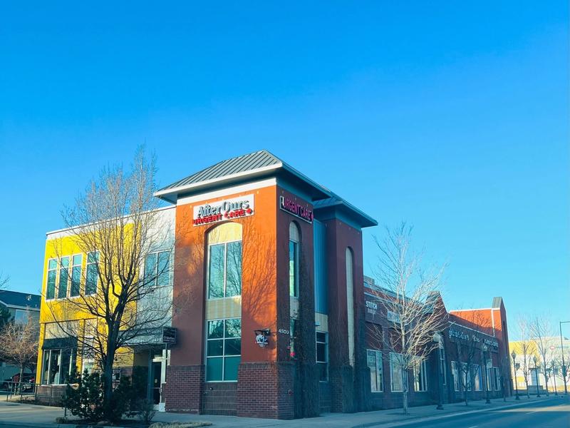 AfterOurs Denver Highlands building on a clear blue-sky morning