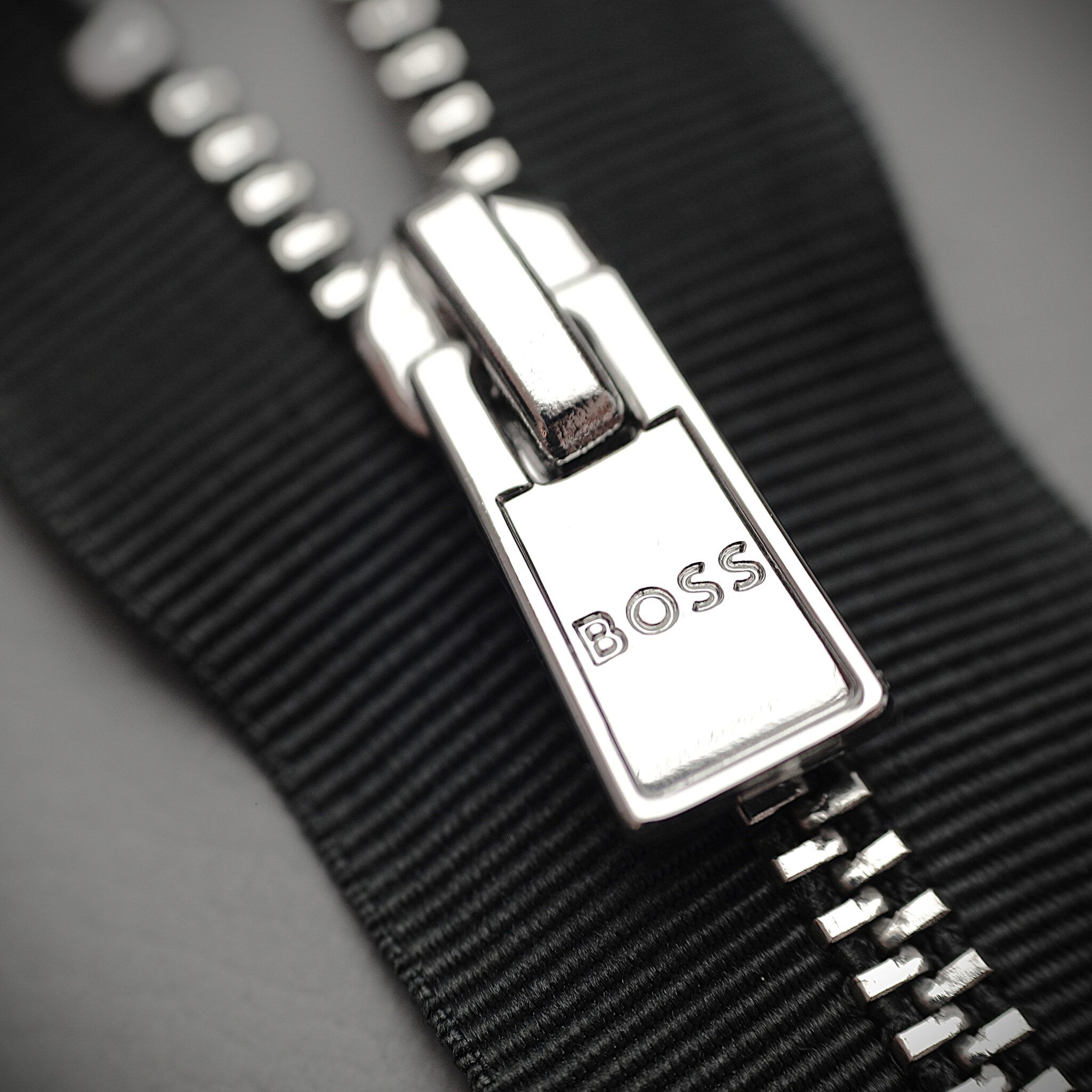 Molded logo zipper puller