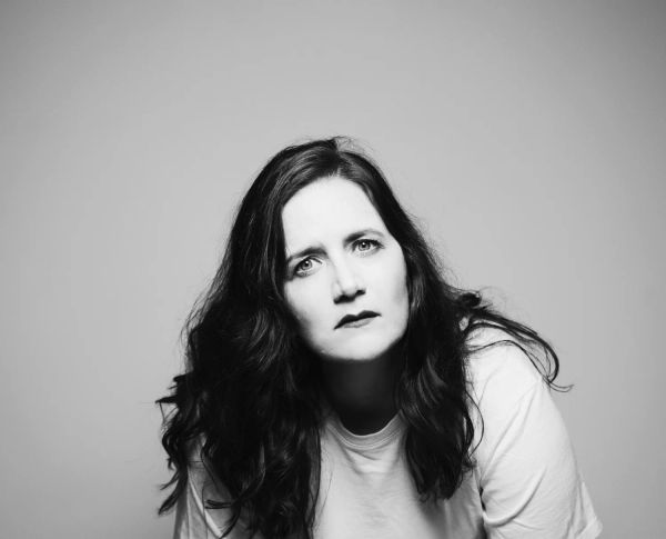 Amy Cervini — black-and-white portrait with direct gaze, hi-res press photo