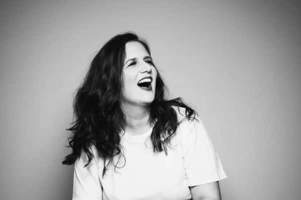 Amy Cervini laughing — black-and-white, hi-res press photo