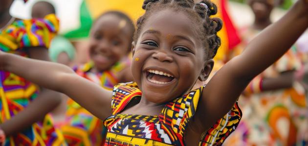 A child celebrating, part of the Ibrahim Impact Foundation community