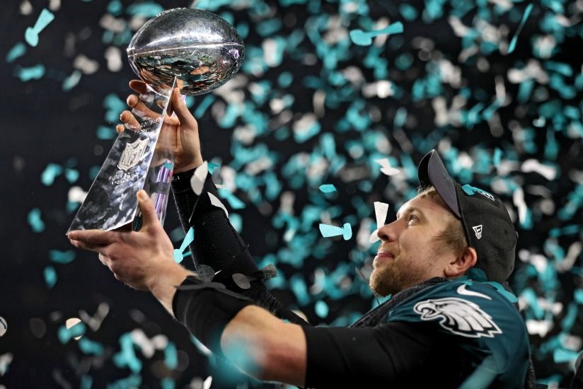 Philadelphia Eagles quarterback Nick Foles raises his arms after