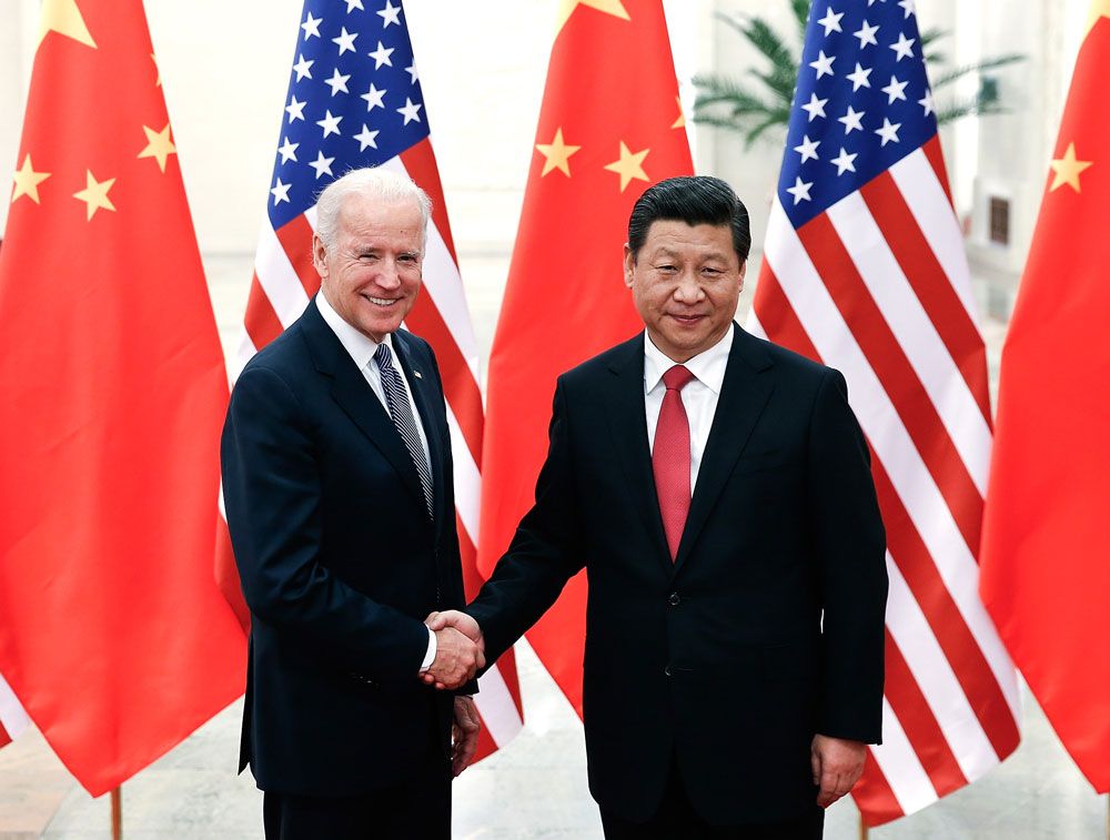 Chinese President Xi Jinping shakes hands with U.S Vice President Joe Biden inside the Great Hall of the People on Dec. 4, 2013, in Beijing