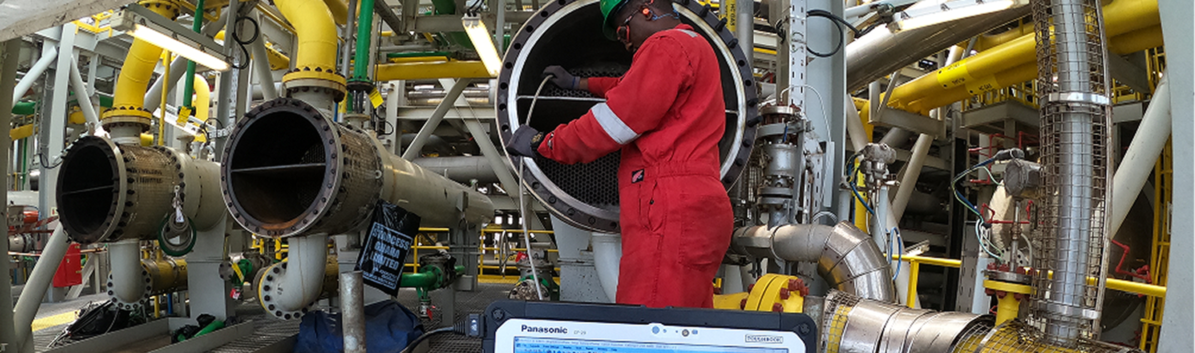 Technician performing eddy current tube inspection onsite