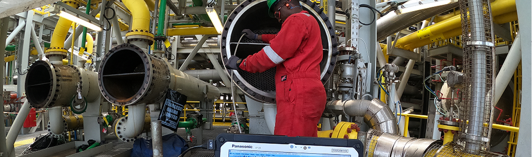 Technician performing eddy current tube inspection onsite