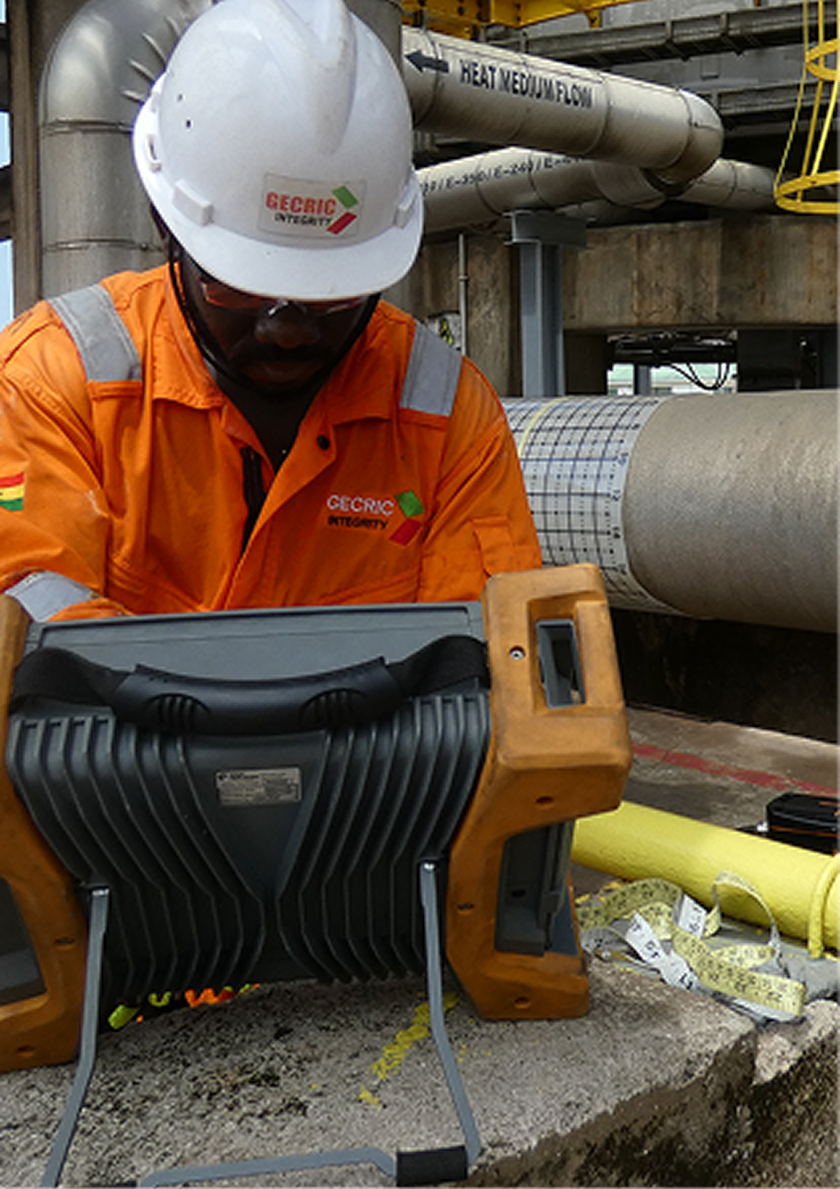 Inspector carrying out non-destructive testing on equipment