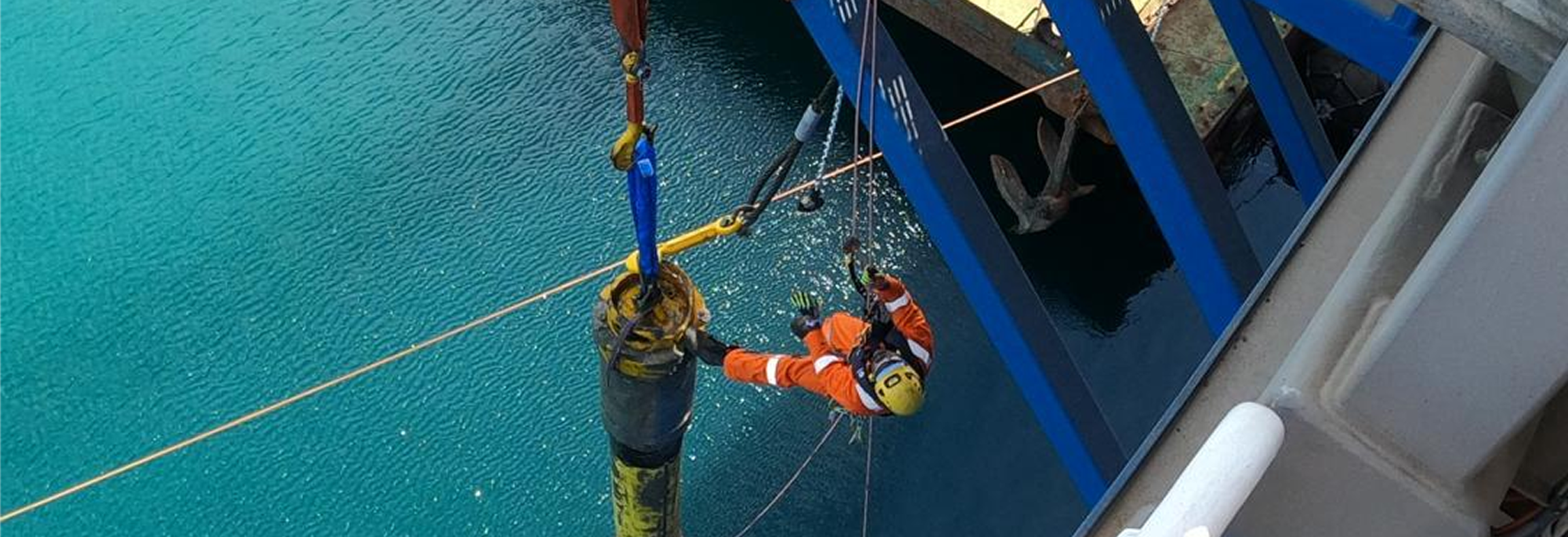 Rope access technicians completing a riser hookup operation