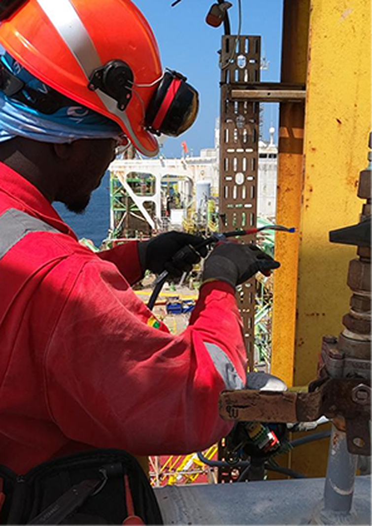 Engineer carrying out repairs on industrial machinery