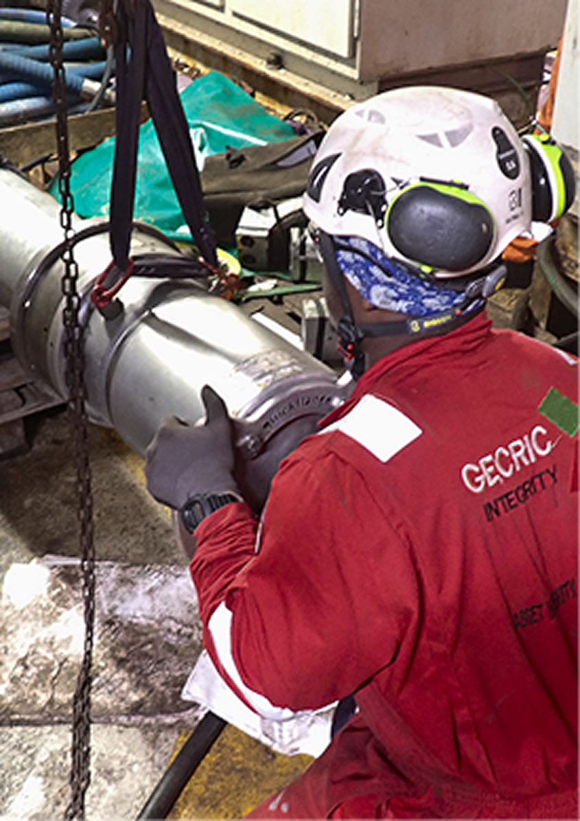 Maintenance crew servicing offshore pipework