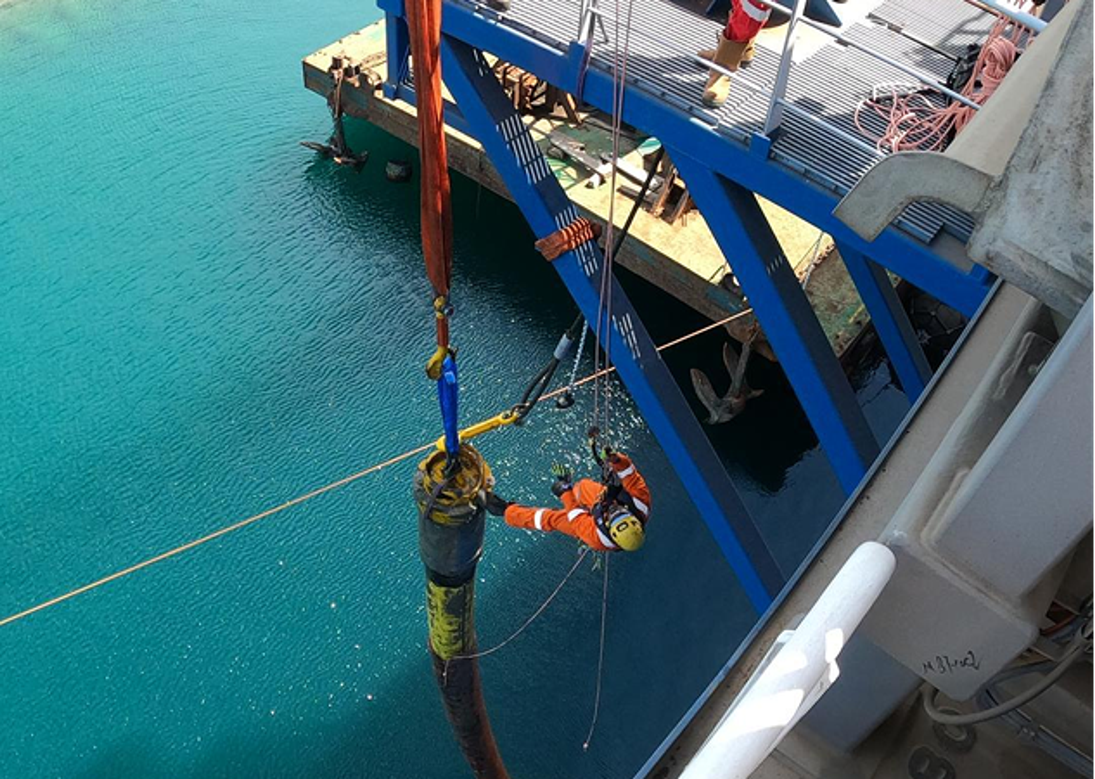 Rope access technicians completing a riser hookup operation