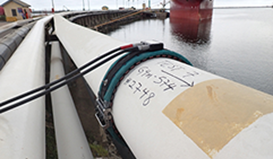 Engineer carrying out guided wave inspection on a pipeline