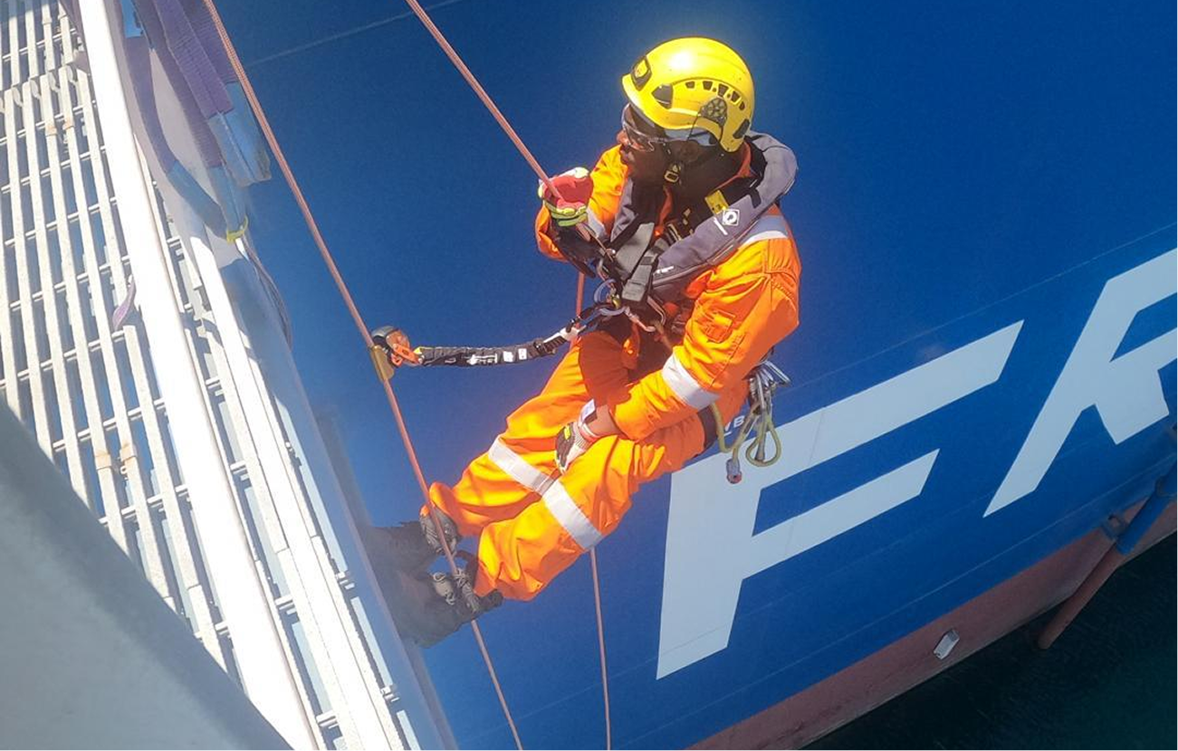 Rope access technicians completing a riser hookup operation