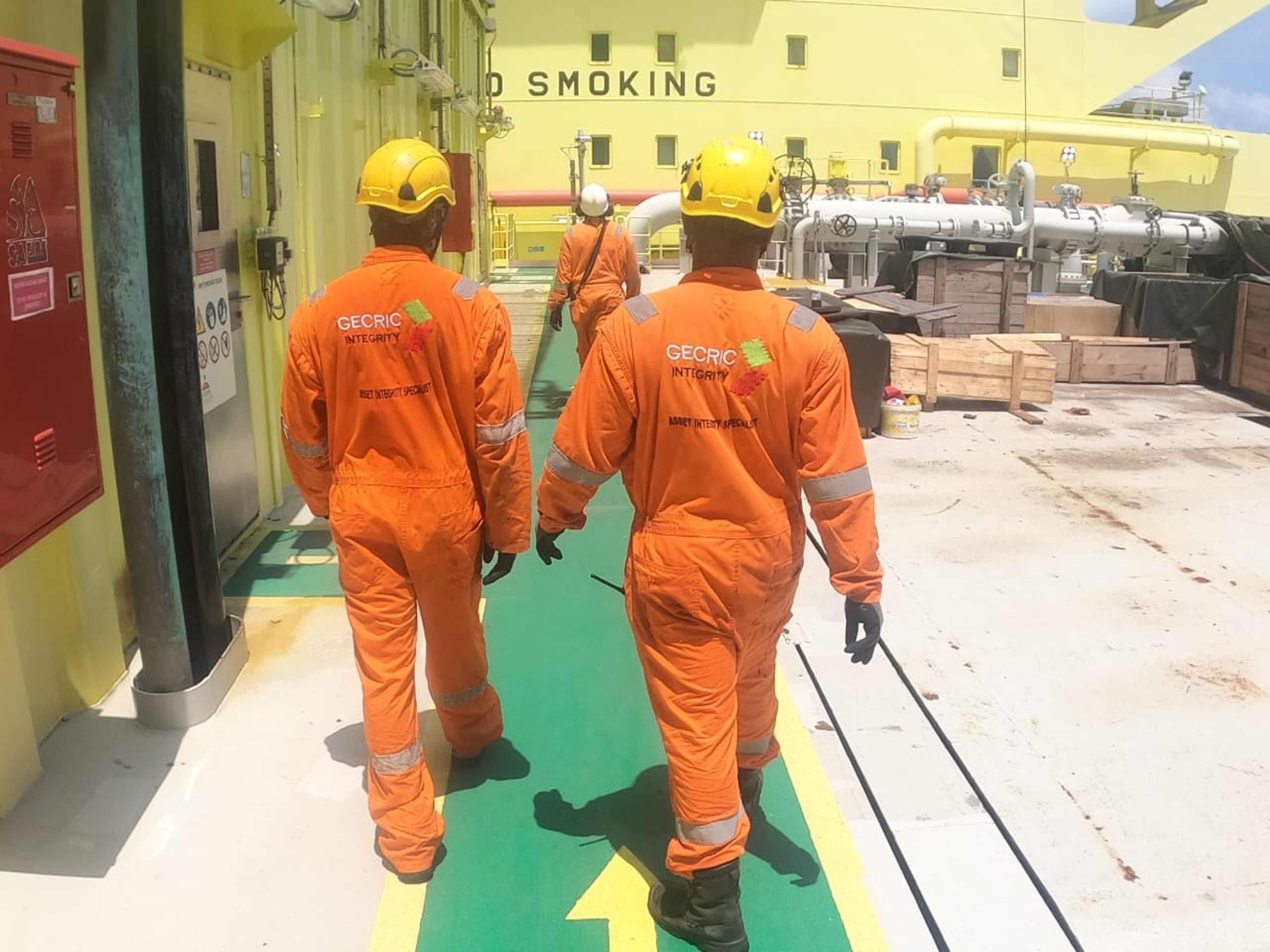 Gecric Integrity specialists in safety gear on an industrial site