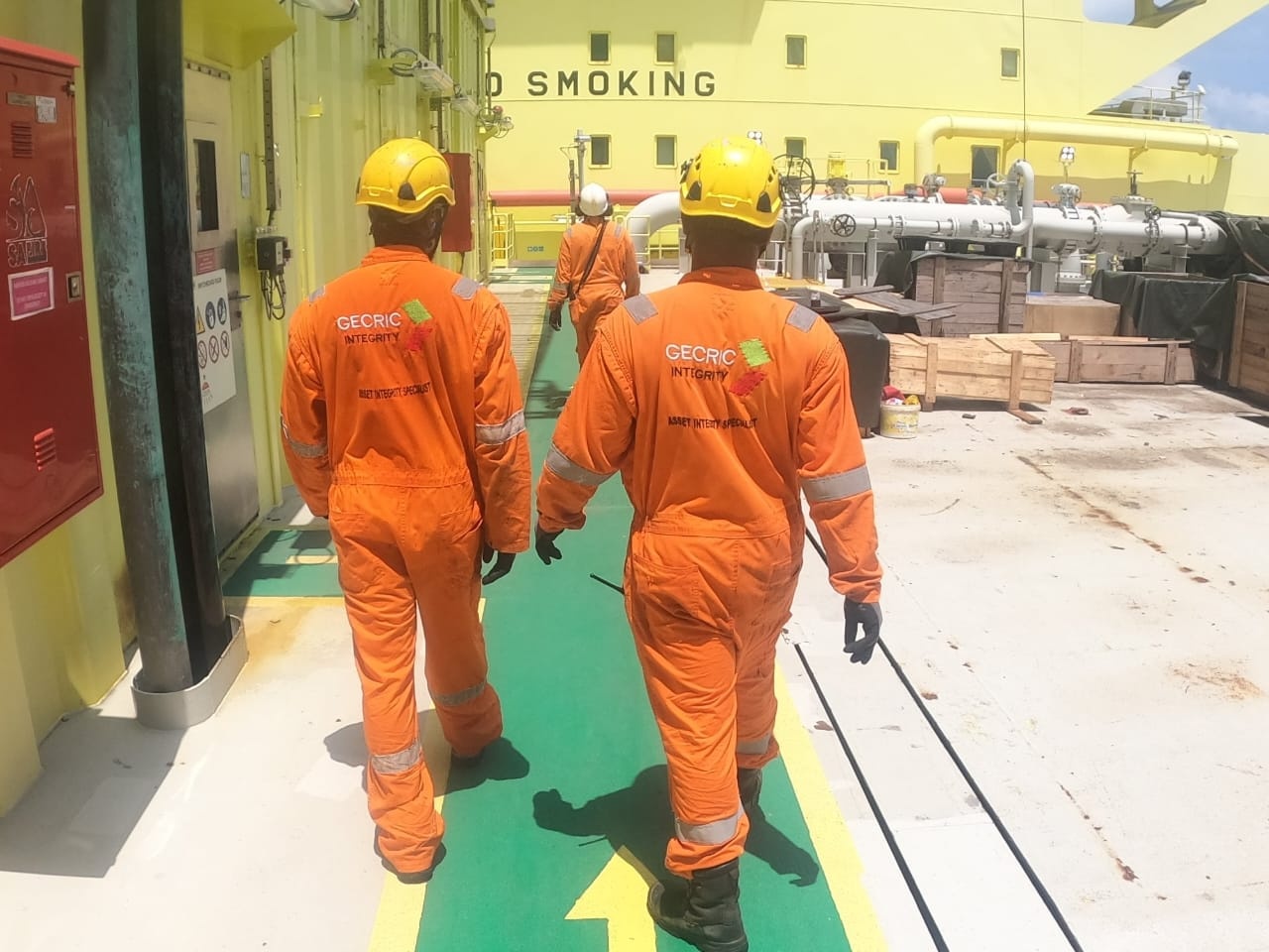 Gecric Integrity specialists in safety gear on an industrial site