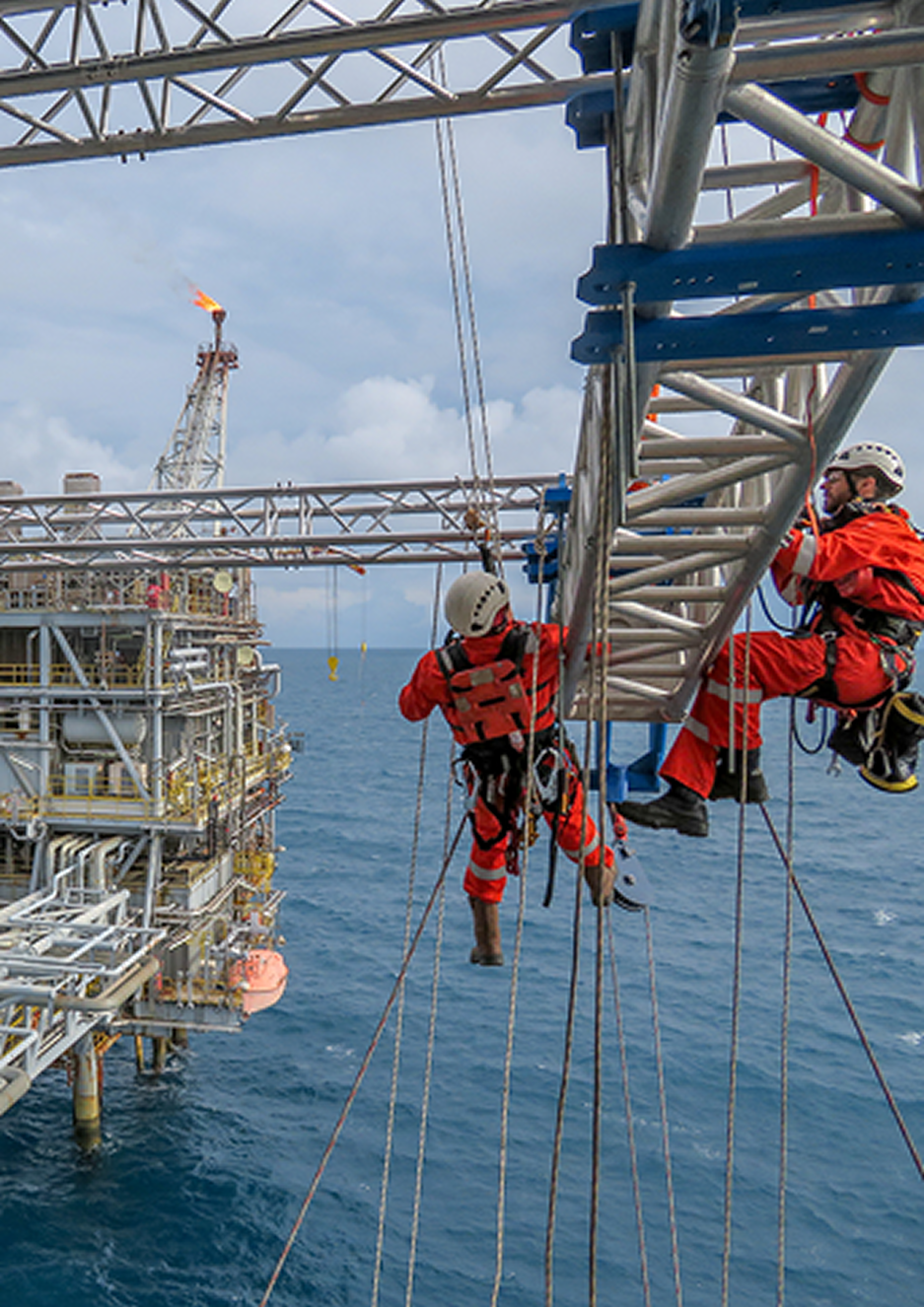 Specialist engineers working on an offshore platform
