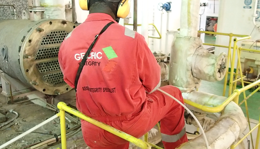 Technician carrying out remote field testing on tube equipment