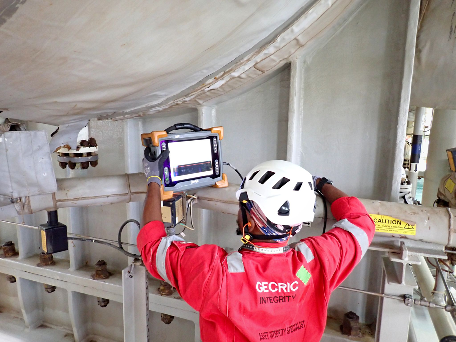 Integrity specialist inspecting industrial equipment