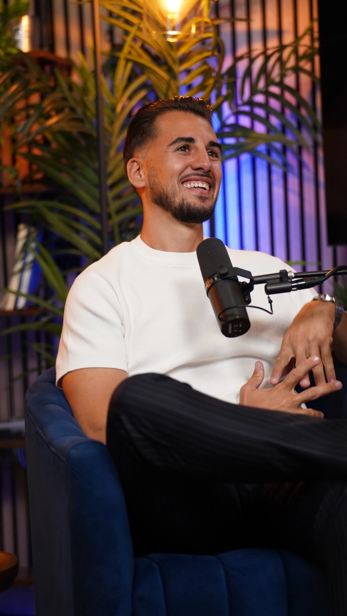 Sebastian Hardy smiling in the studio