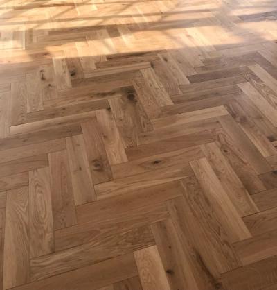 Wooden herringbone style solid flooring