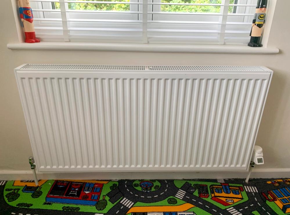 White standard radiator in a kids room