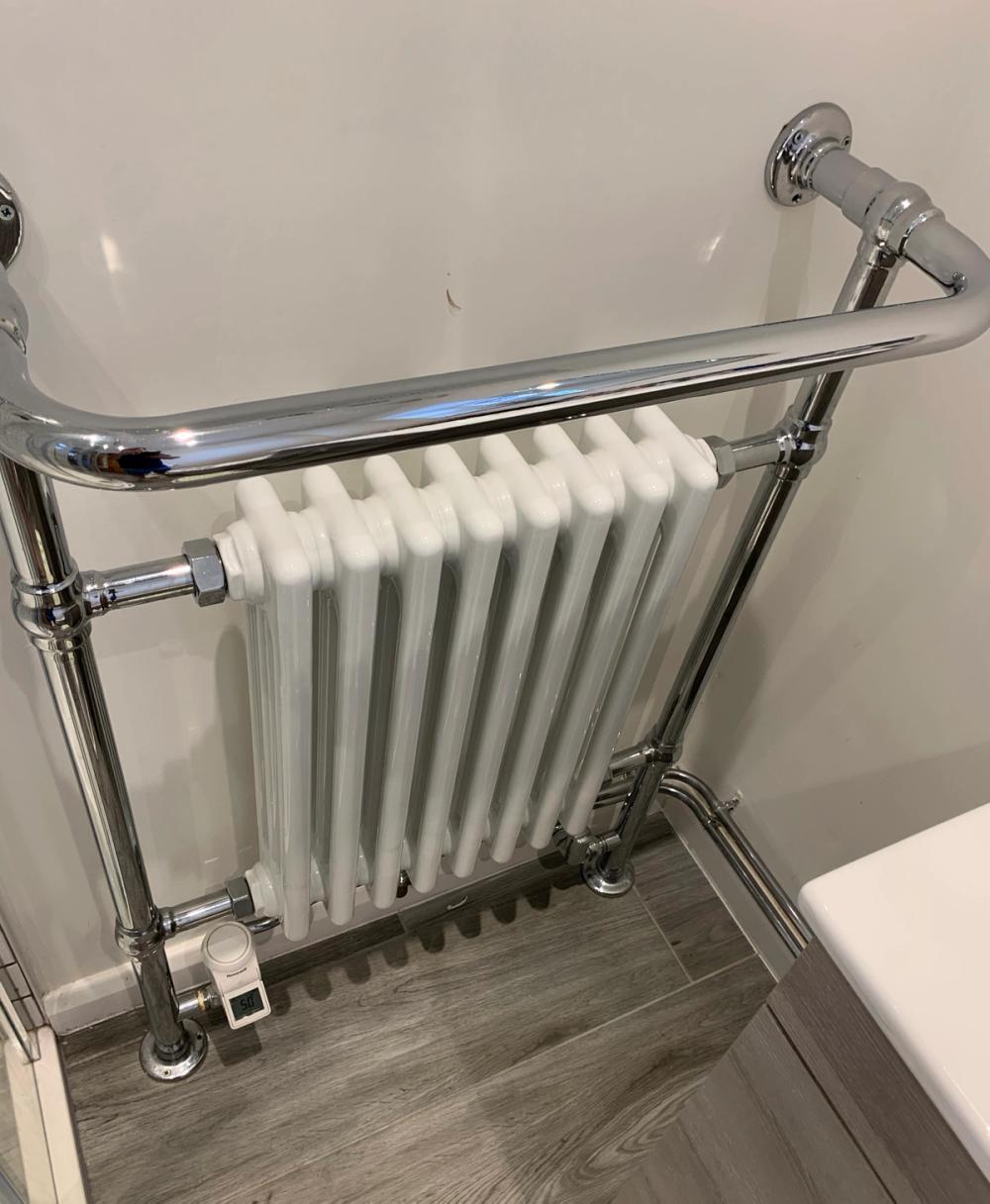 Modern old style radiator with towel rail