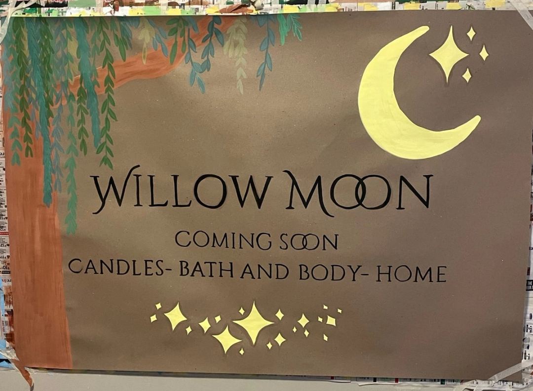 Storefront banner reading "Willow Moon, Coming Soon, Candles, Bath and Body, Home" with a painted willow tree, crescent moon and stars.