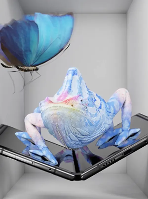 3D render of a photorealistic chameleon sitting on a Google Pixel Fold and looking at a butterfly