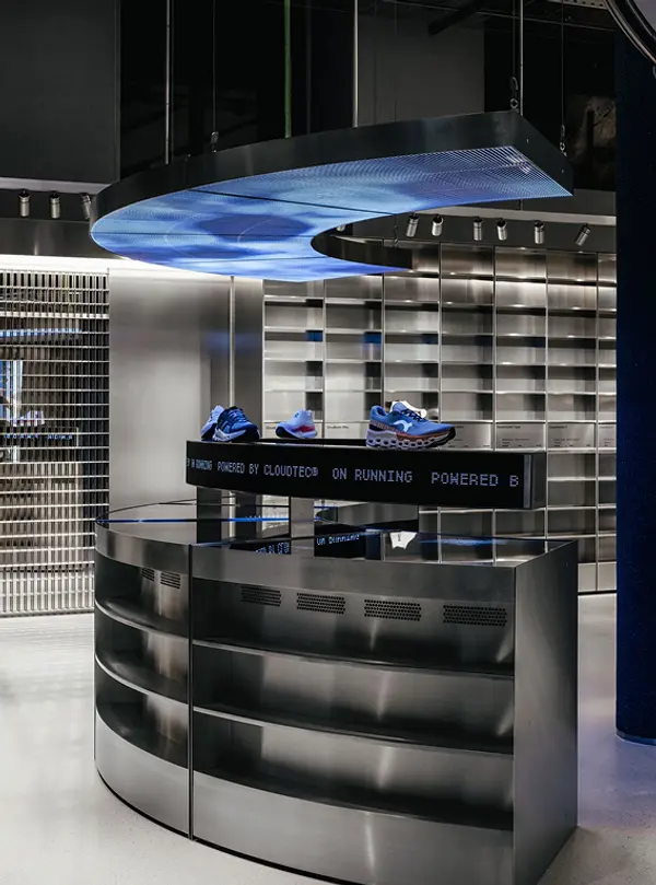 Wide shot of the ON Movement Lab Zurich store with the interactive display at the centre