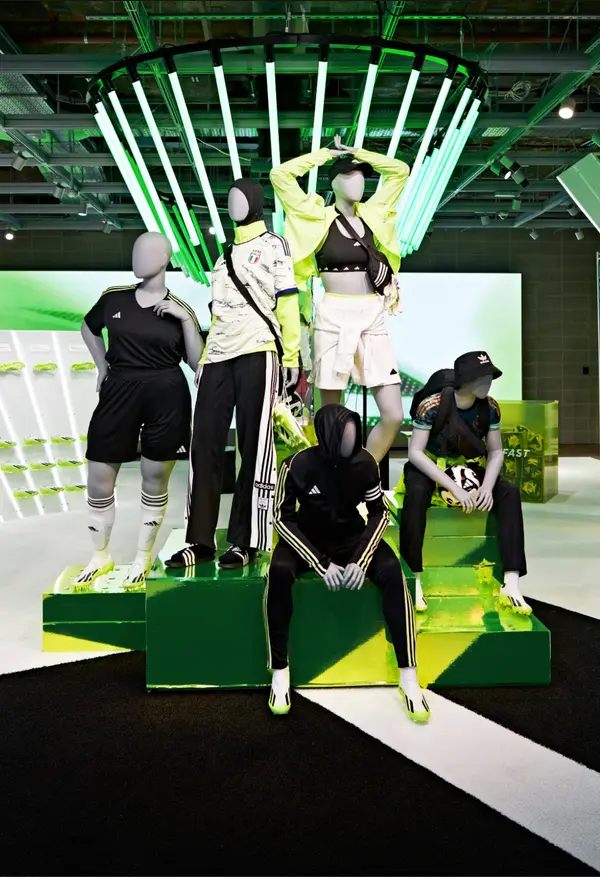 Adidas X Crazyfast retail display with mannequins set against a reactive light installation