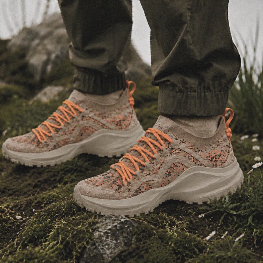 Grit shoes worn on a mossy outcrop in a natural outdoor setting