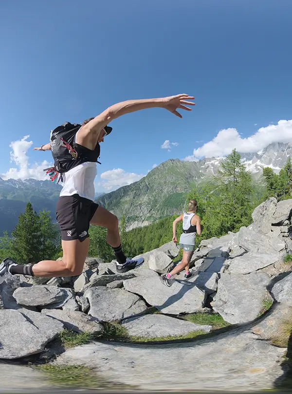 Trail runners wearing The North Face VECTIV shoes running across rocky mountain terrain