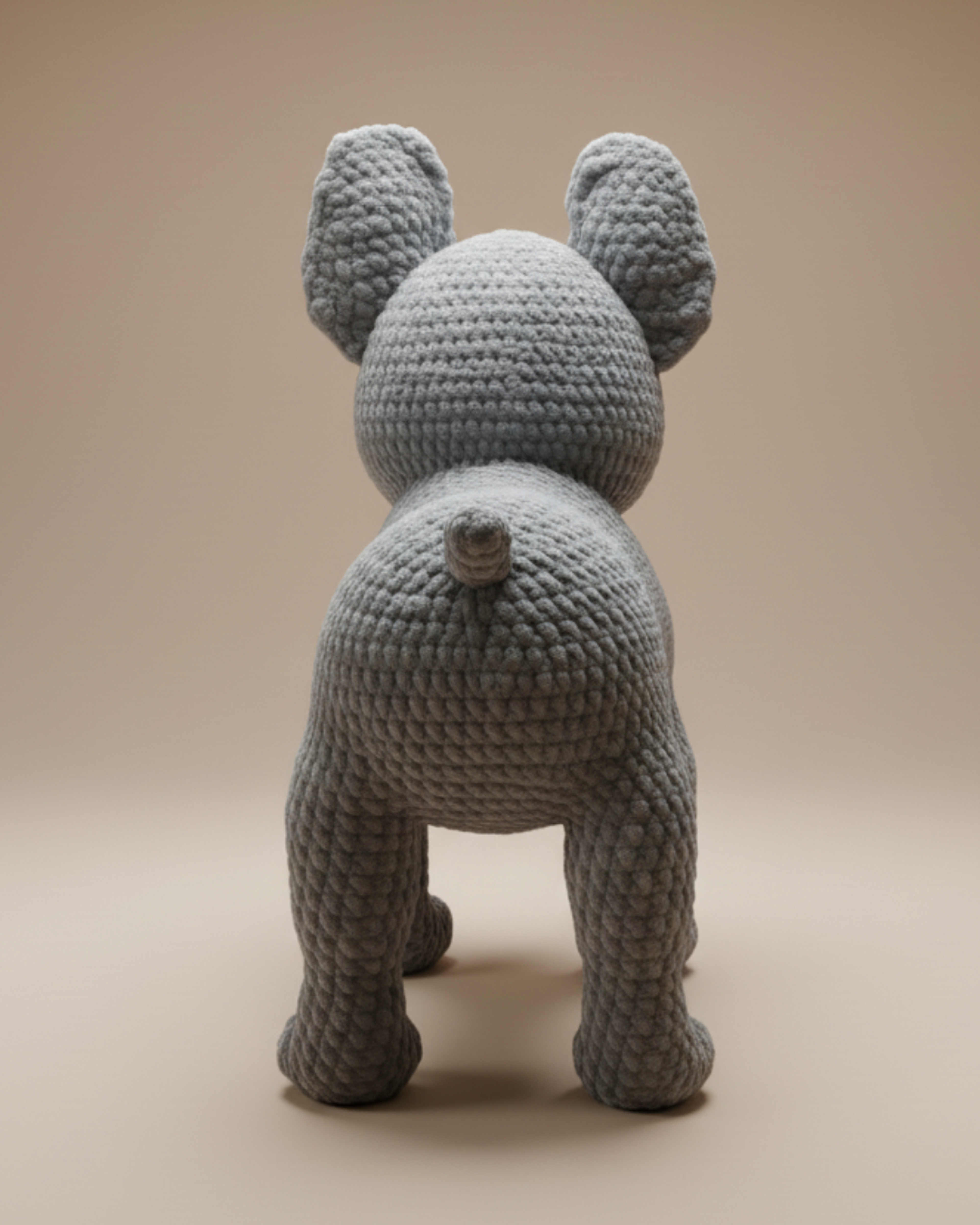 Bulldog crochet pattern amigurumi showing the rear view with detailed stitching and tail design