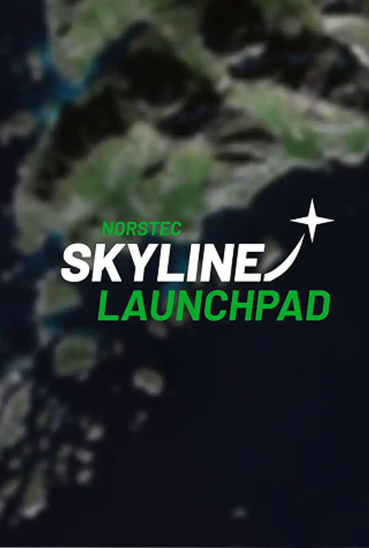 Satellite view of a coastal region with green mountains, rocky islands, and deep blue ocean.