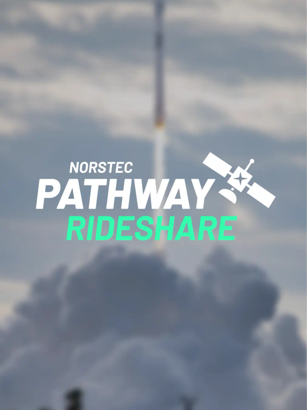 Rocket launching upward through thick clouds, leaving a bright plume against a partly cloudy sky.