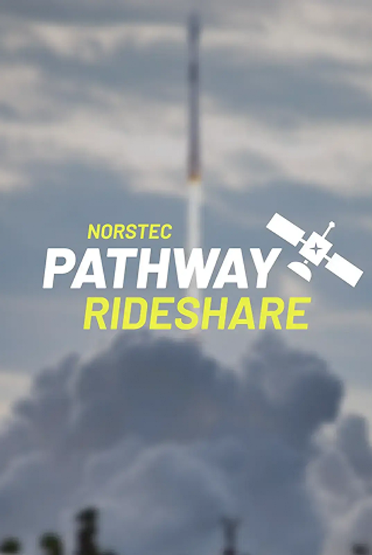 Rocket launching upward through thick clouds, leaving a bright plume against a partly cloudy sky.