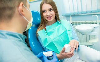Woman at the dentist in the dental chair