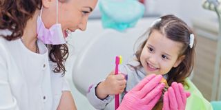 Image of the DentalCare Carnegie team in the receptionist area of the dental clinic.