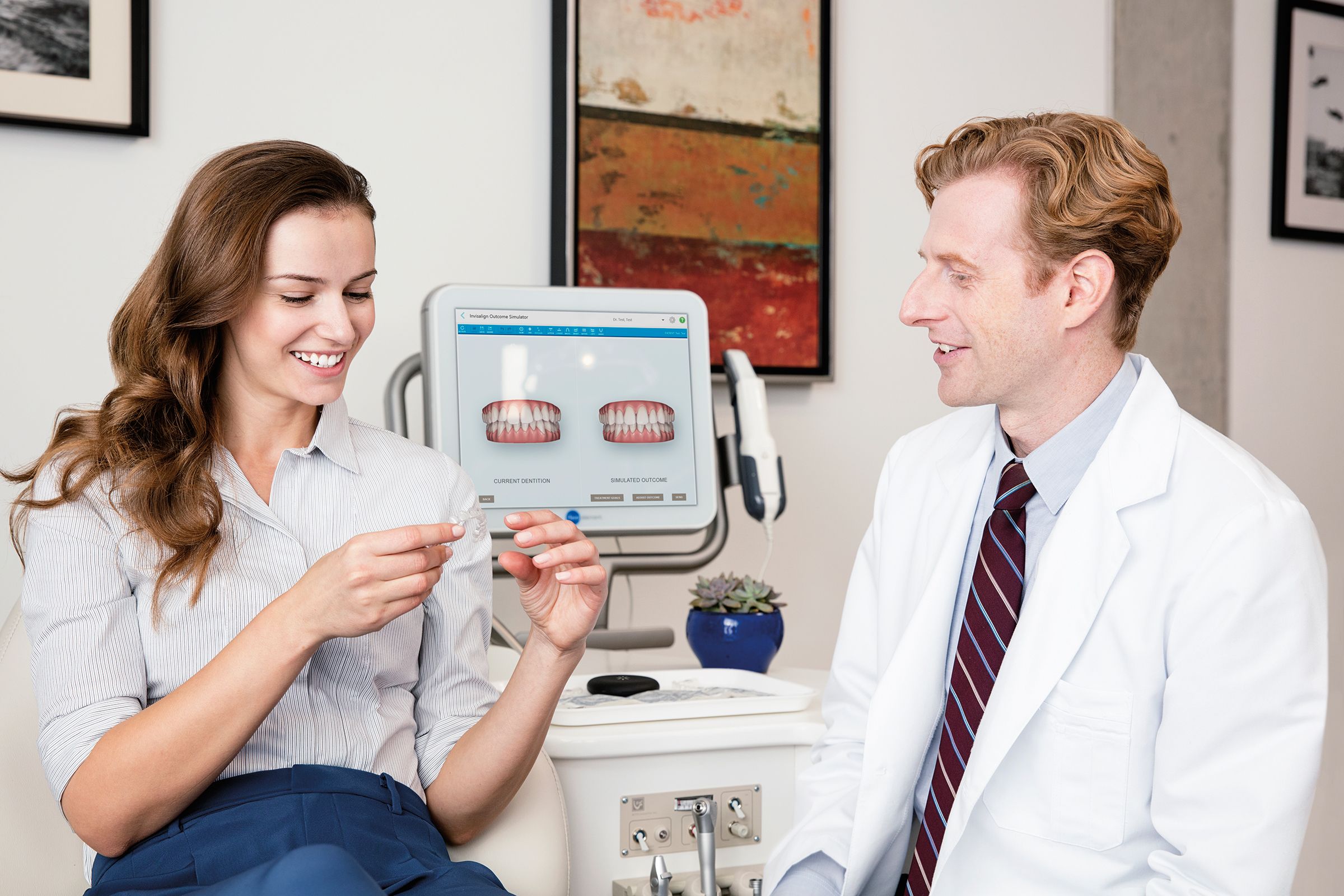A woman consulting her dentist on the options she has to make her smile whiter.