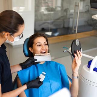 Image of a patient picking the right type of shade for their dental veneers.