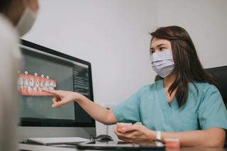 Image of a 3D dental scan of a patient's teeth being reviewed by our dental team.