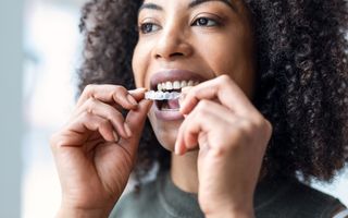 Woman trying on her clear aligners