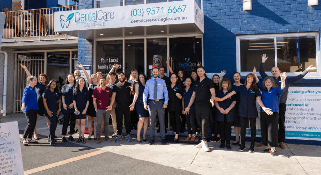 Image of a cheerful team line-up with DentalCare Carnegie on Koornang Road.