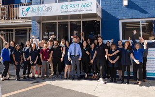Image of a cheerful team line-up with DentalCare Carnegie on Koornang Road.