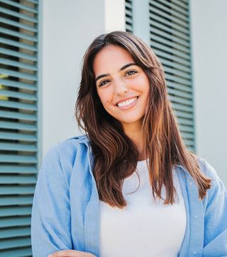 Image of a young female, with a nice smile. At Richmond Fine Dentistry, your dental health is our priority.