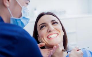 Patient with dentist discussing dental treatment
